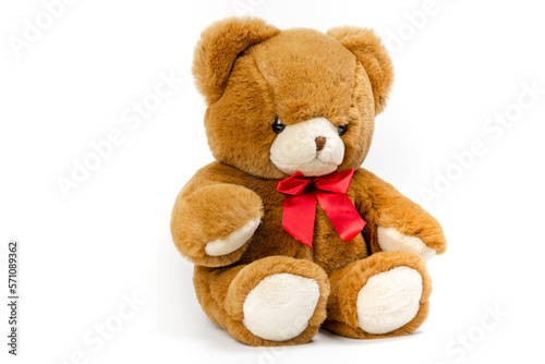 Cute Brown Teddy bear with a red ribbon on a white background. Plush toys for kids.