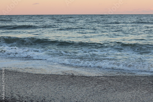 waves on the beach at sunset
