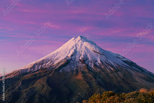 Mount Taranaki at sunrise with purple sky and clouds