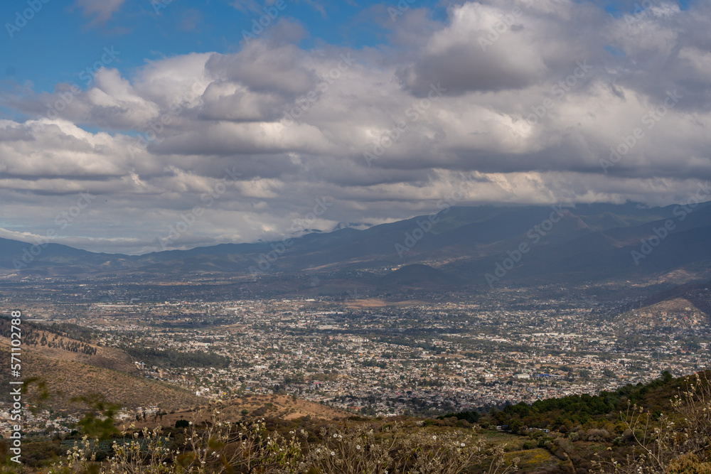 Beautiful view of the large Mexican city of Oaxaca from Monte Alban. View of the endless mountain peaks.