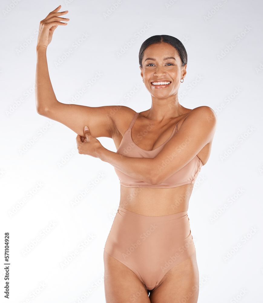 Obraz premium Health, muscle flex and portrait of black woman on white background with smile, body wellness and beauty. Fitness, exercise and girl excited for weight loss, healthy lifestyle and progress in studio
