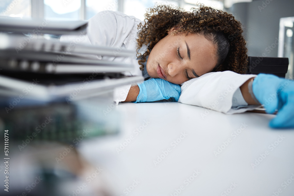 Science, exhausted and scientist taking nap in lab after working on innovation experiment, test or research. Tired, burnout and professional female scientific employee sleeping on desk in laboratory. Science, exhausted and scientist taking nap in lab after working on innovation experiment, test or research. Tired, burnout and professional female scientific employee sleeping on desk in laboratory.