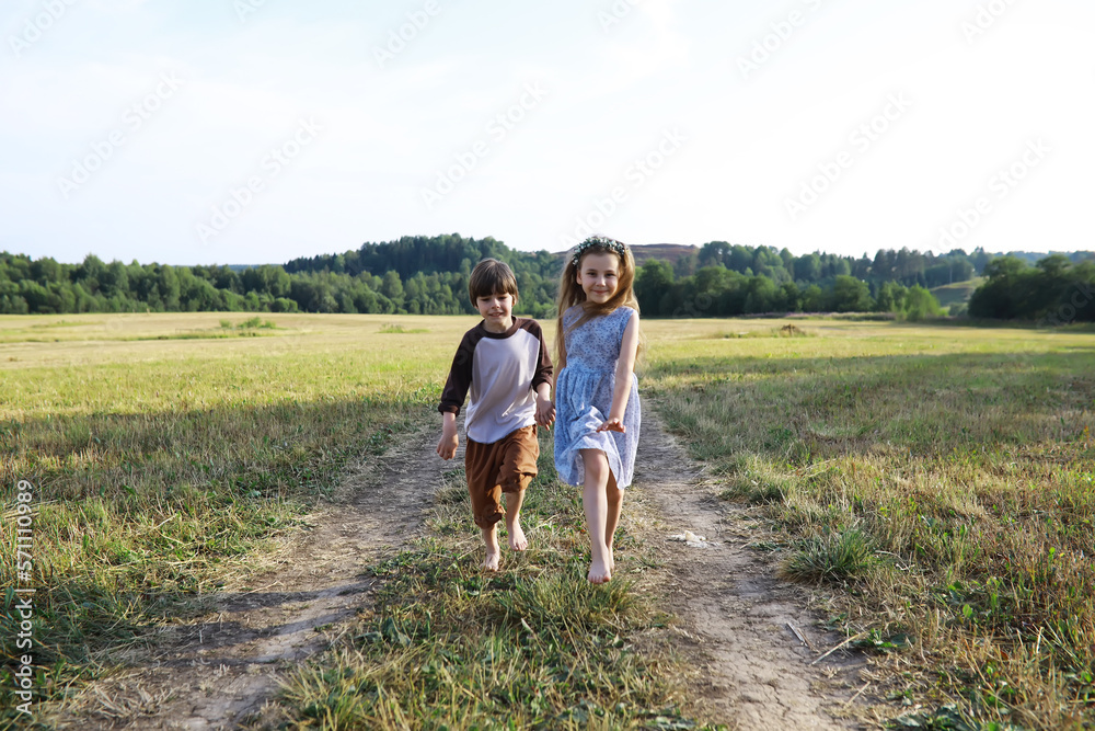 Children walk in the summer in nature. Child on a sunny spring morning in the park. Traveling with children. Children walk in the summer in nature. Child on a sunny spring morning in the park. Traveling with children.