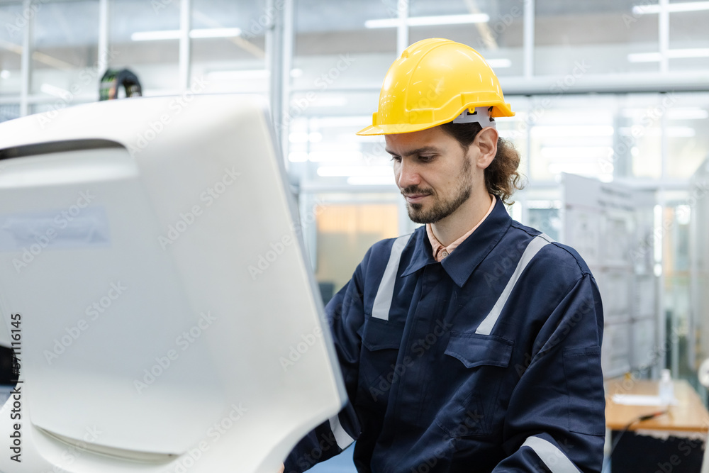 Man engineer using computer controlling cnc machine at workshop. professional male control automated machine process programming cnc machine at industry manufacturing. Man engineer using computer controlling cnc machine at workshop. professional male control automated machine process programming cnc machine at industry manufacturing.