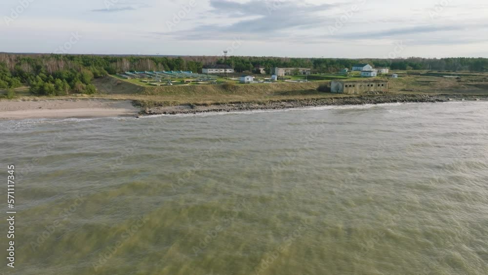 Aerial establishing view of water basins at sewage treatment plant near Baltic sea, ponds for recycling dirty wastewater, recycle system technology, waste management theme, drone shot moving forward Aerial establishing view of water basins at sewage treatment plant near Baltic sea, ponds for recycling dirty wastewater, recycle system technology, waste management theme, drone shot moving forward