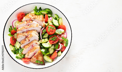 Salad with chicken meat. Fresh vegetable salad with chicken breast. Meat salad with chicken fillet and fresh vegetables on plate.