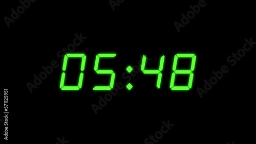 4-digits 25 seconds digital clock count-up timer. Green and black colour. Retro digital alarm clock concept photo