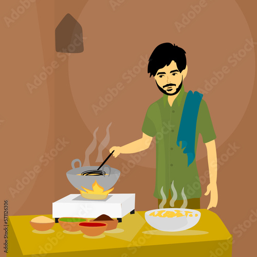 Indian Countryside man cooking at traditional kitchen, preparing meals.