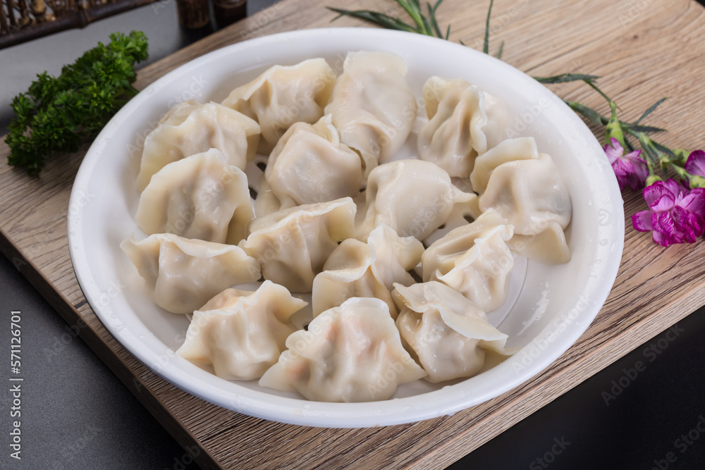 Chinese gourmet dumplings on a white plate