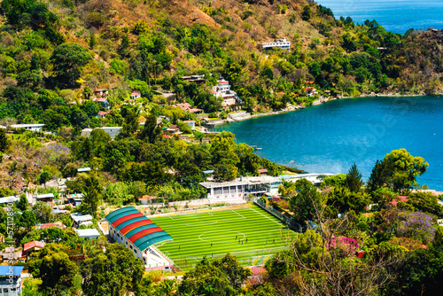 Sports court, village, lake and mountains, San Marcos la Laguna, Guatemala photo