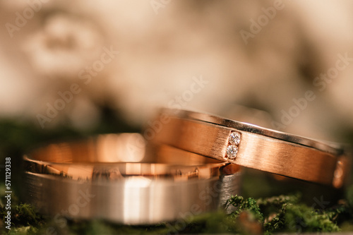 Gold wedding rings. Wedding symbols, attributes. Holiday, celebration. Concept wedding details. Happy family. Together. marr photo