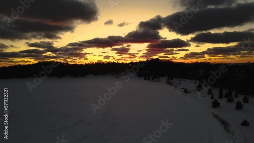 Sunlight in the early evening over an Icy Lake. photo