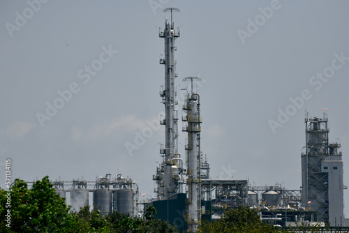 Industrial oil and gas refinery plant form industry zone and 0il storage at sunset.