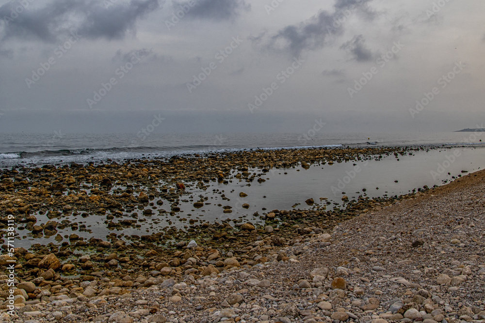landscape empty rocky beach on a cloudy day spain