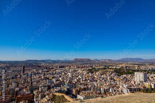 view on a sunny day of the city and colorful buildings from the viewpoint Alicante Spain © Joanna Redesiuk
