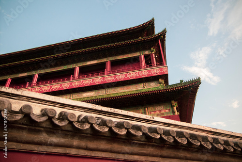 Street around Drum Tower in the city center of Beijing China. With blue sky over the roof building. Typical chinese style historical palace photo