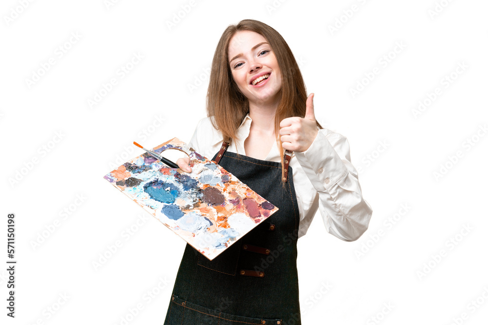 Young artist woman holding a palette over isolated chroma key background with thumbs up because something good has happened Young artist woman holding a palette over isolated chroma key background with thumbs up because something good has happened