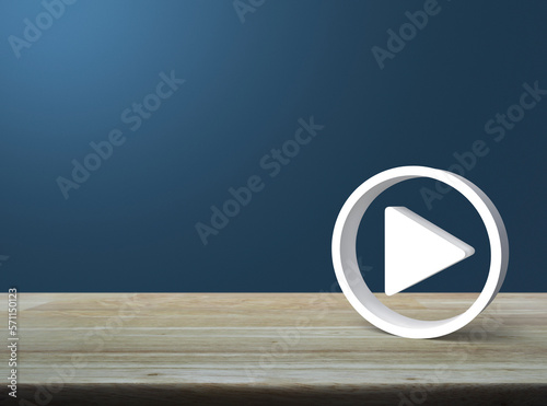 Play button 3d icon on wooden table over light blue wall, Business music online concept