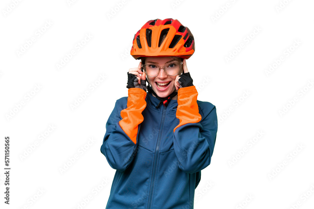 Young cyclist woman over isolated chroma key background with glasses and surprised Young cyclist woman over isolated chroma key background with glasses and surprised
