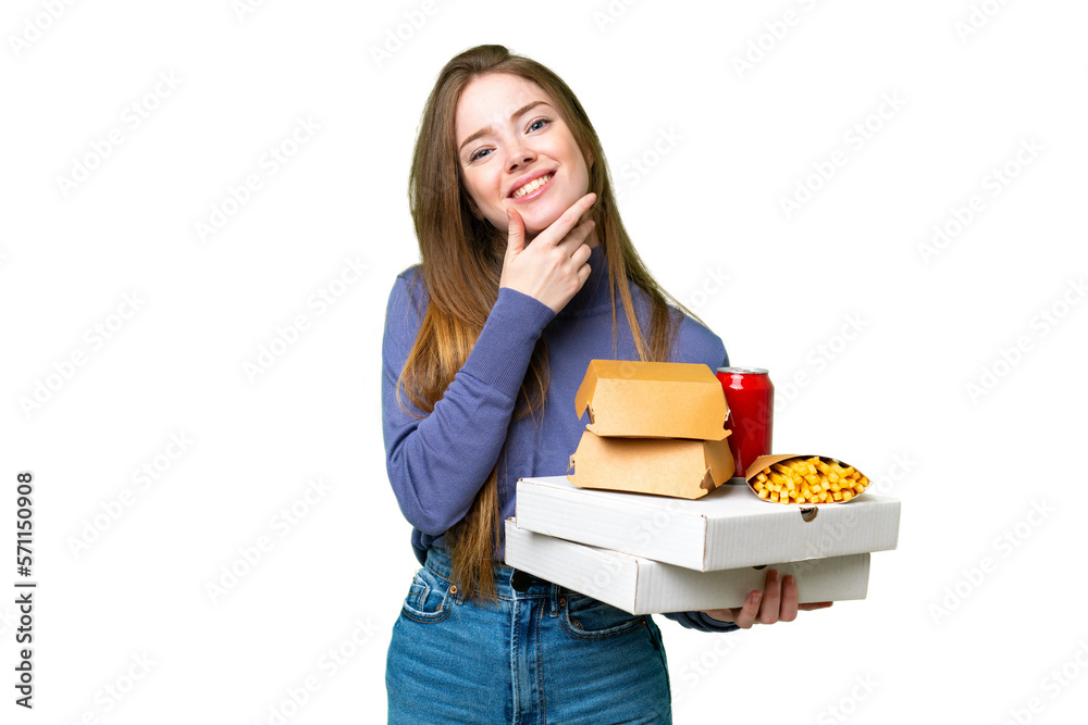 Young pretty woman holding pizzas and burgers over isolated chroma key background happy and smiling Young pretty woman holding pizzas and burgers over isolated chroma key background happy and smiling