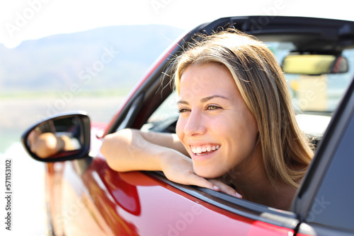 Happy car convertible driver laughing
