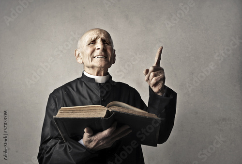 portrait of priest reciting the gospel photo