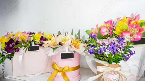 Flower shop window, flower arrangement in a box, bouquets. Concept: flower shop. small business. Floristics. delivery of flowers and gifts. holiday, nobody. Birthday. Showcase.Wallpaper