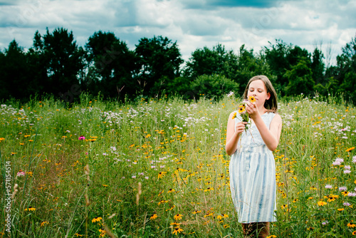 Girl Picking Wild Flowers in a Southen Michigan Field photo