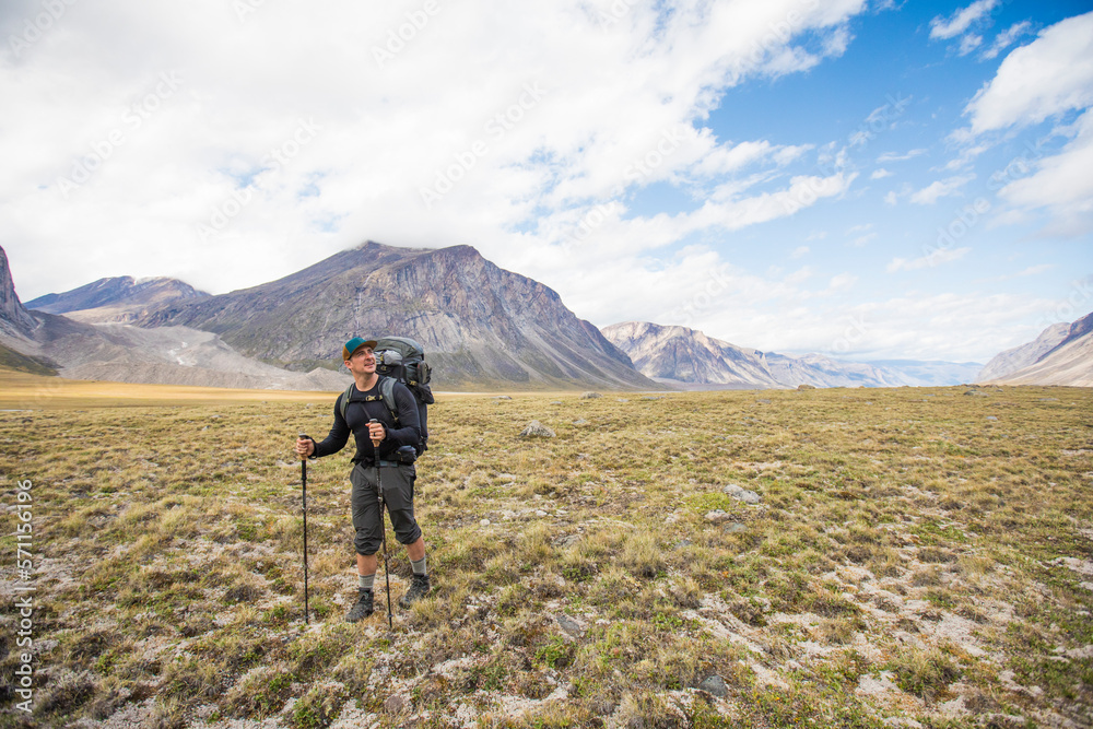 Man hiking in Akshayak Pass, Canada. Man hiking in Akshayak Pass, Canada.