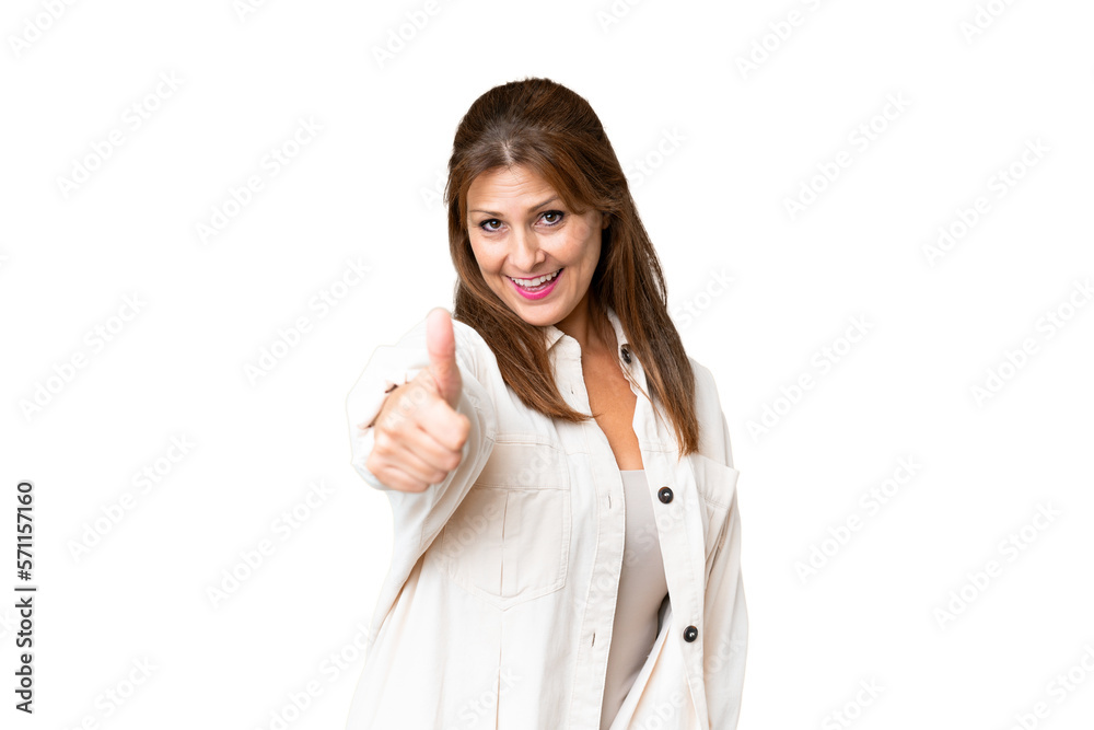 Middle age woman over isolated background with thumbs up because something good has happened Middle age woman over isolated background with thumbs up because something good has happened
