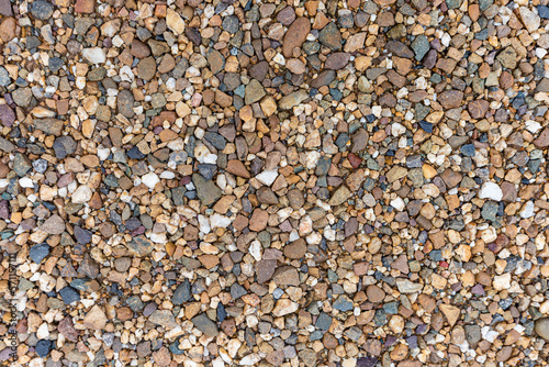 Background texture of pebbles. Small stones on the ground.