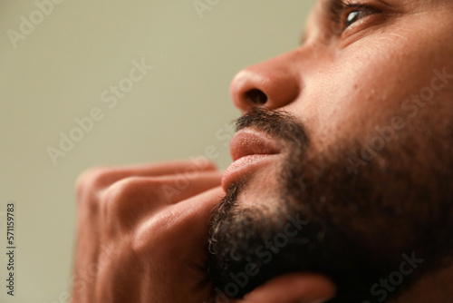 Close-up portrait of man, posing indoor. Mind set and mental health. Vertical.
