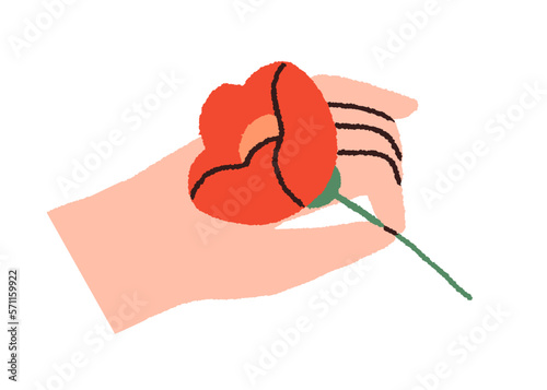 Hand holding flower, presenting spring floral plant. Single blossomed bloom i...
