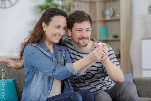 Fototapeta Naklejka Na Ścianę i Meble -  couple happy with results of pregnancy test