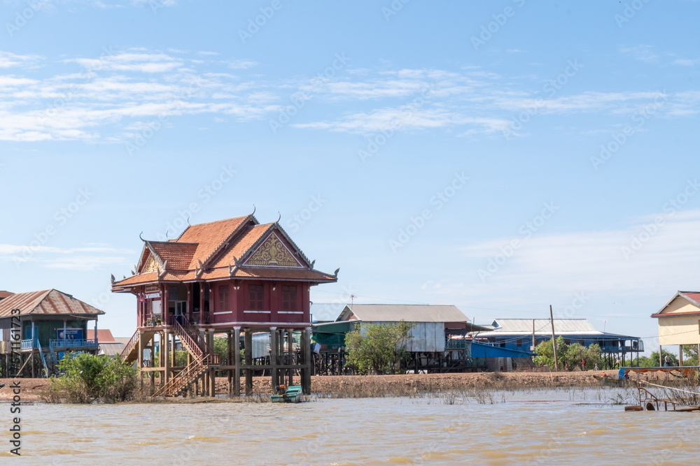 A floating houses on the Tonle Sap lake - close to Siem Reap. Cambodia A floating houses on the Tonle Sap lake - close to Siem Reap. Cambodia