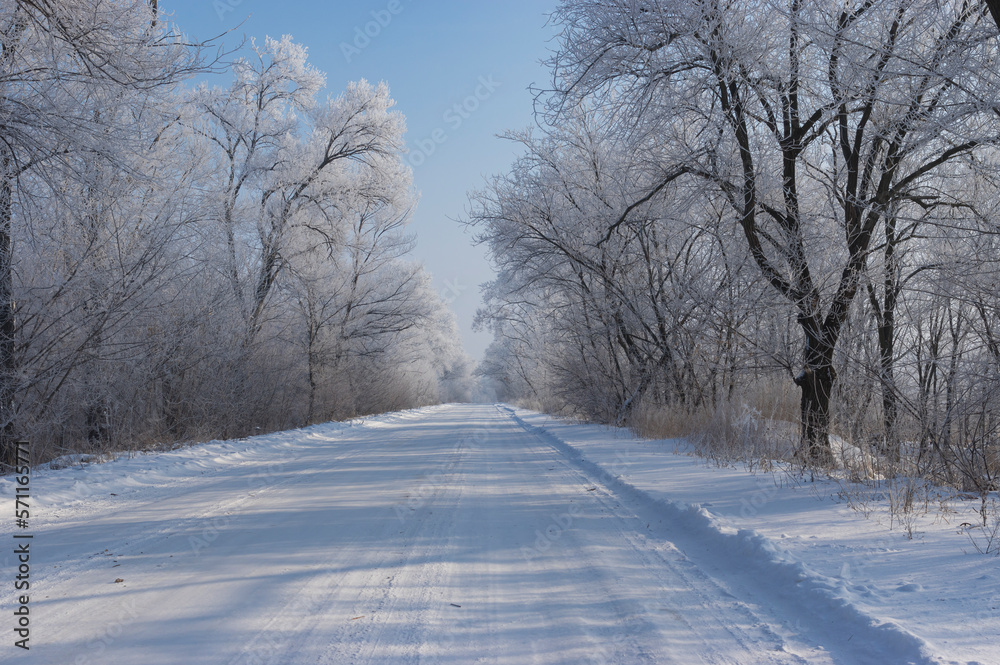 Winter landscape with slippery country road in Dnipropetrovsk oblast in Ukraine
