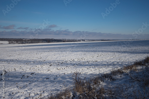 Ukrainian landscape with agrilultural filds cobered with snow near  Verkhnyodniprovsk city located in Dnipropetrovsk Oblast  province 
