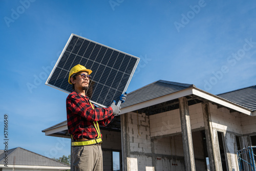 Wallpaper Mural Engineers in helmets installing solar panel system outdoors. technician use a the Electric drill installing the solar panels at roof top of home and home office. Torontodigital.ca