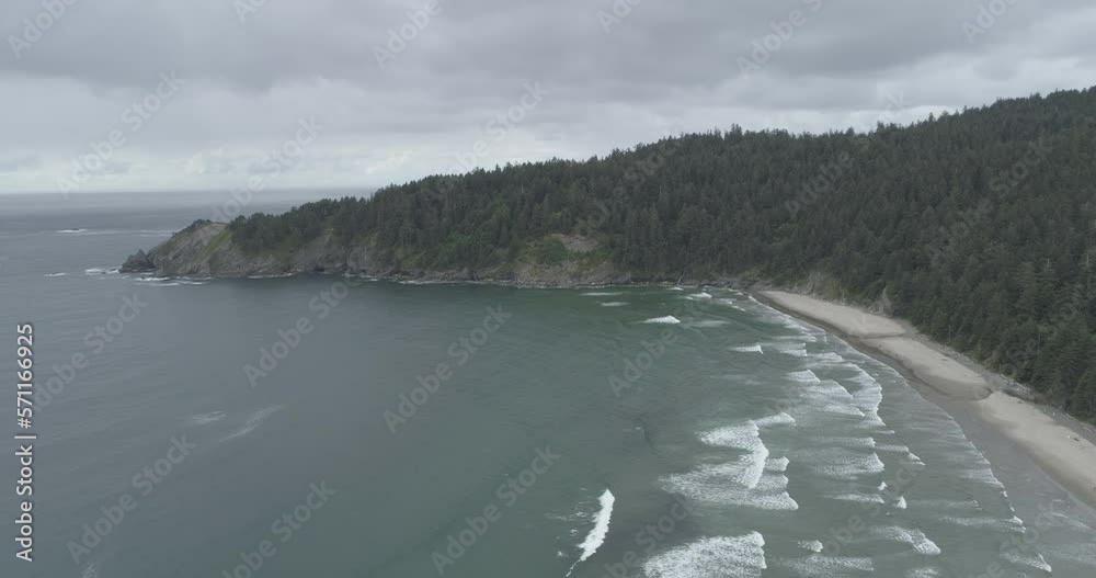 Stabilized shot of mountain by sea against cloudy sky Stabilized shot of mountain by sea against cloudy sky