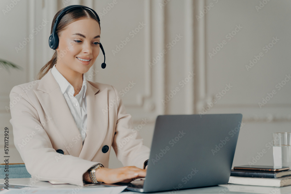 Successful business woman in suit talking online with copartner Successful business woman in suit talking online with copartner