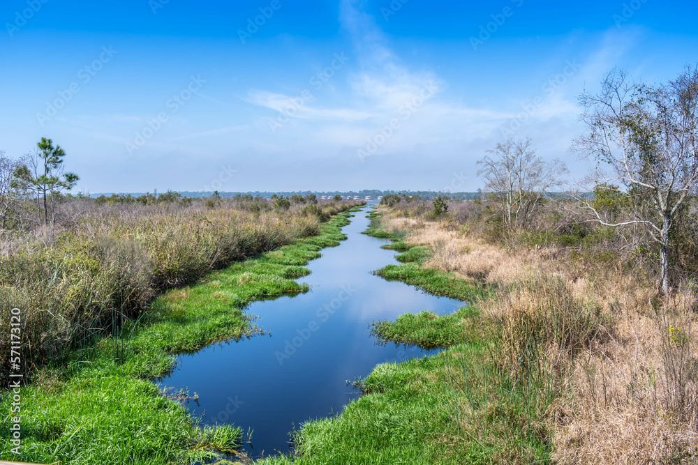 A narrow stream of water in Gulf Shores, Alabama A narrow stream of water in Gulf Shores, Alabama