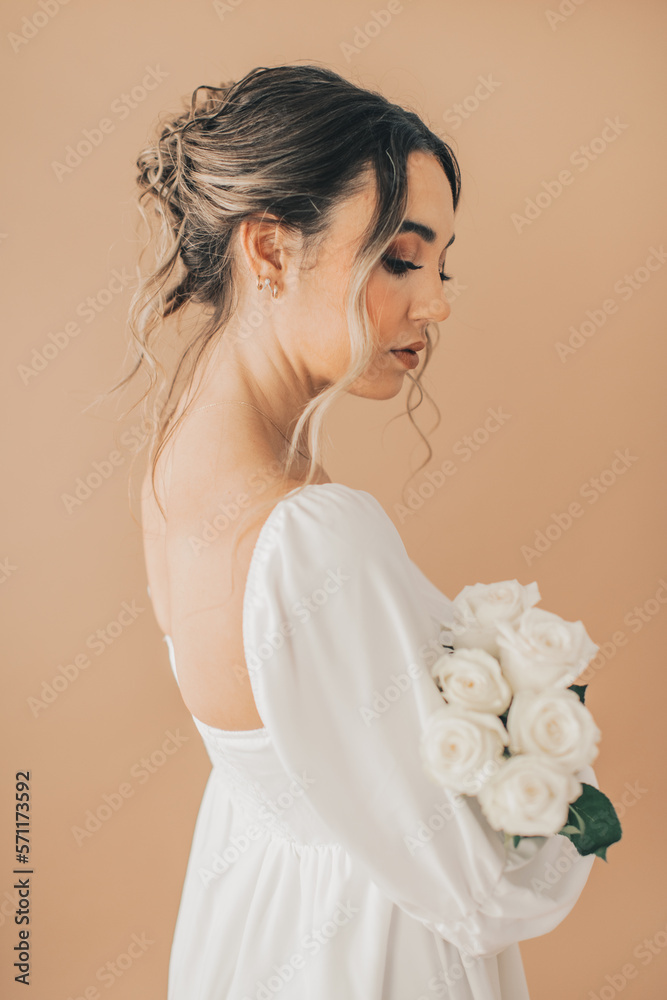Close Up of Woman Elegantly Holding White Roses Close Up of Woman Elegantly Holding White Roses
