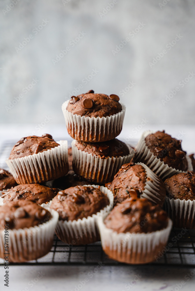Close up of many chocolate chip zucchini muffins on white background. Close up of many chocolate chip zucchini muffins on white background.