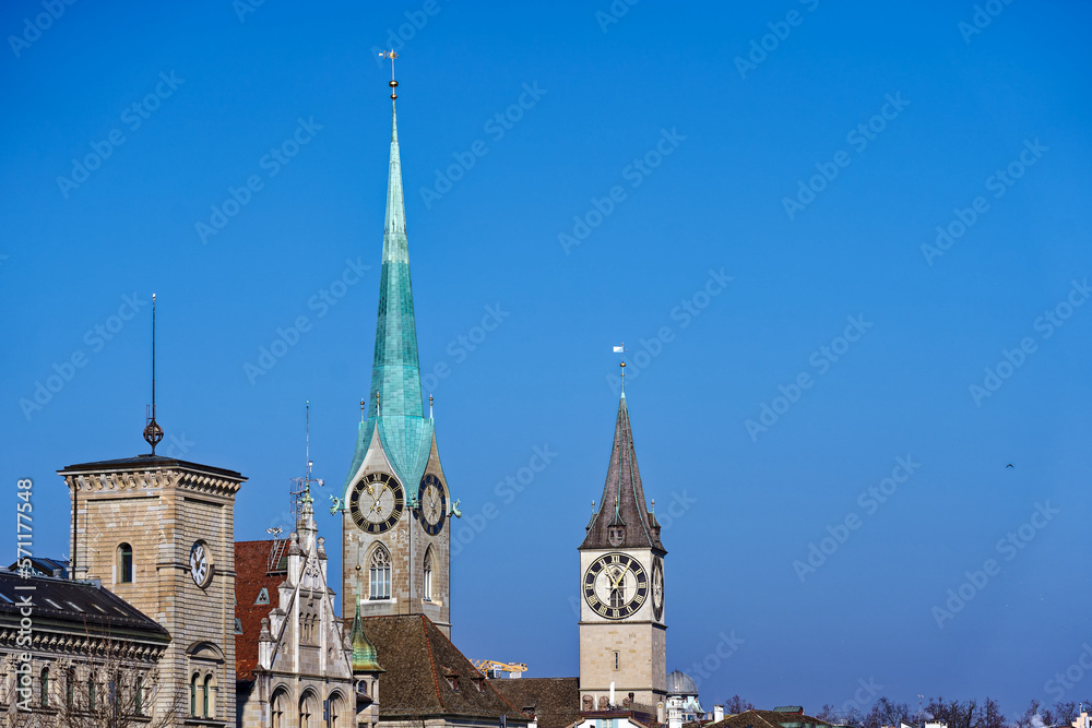Scenic view of Limmat River with churches and the skyline of the old town of City of Zürich on a sunny winter day. Photo taken February 9th, 2023, Zurich, Switzerland.