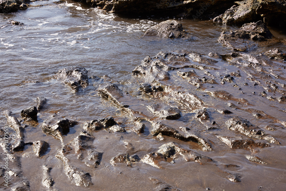Landscape of sand and sea water in volcanic zone in the canary islands