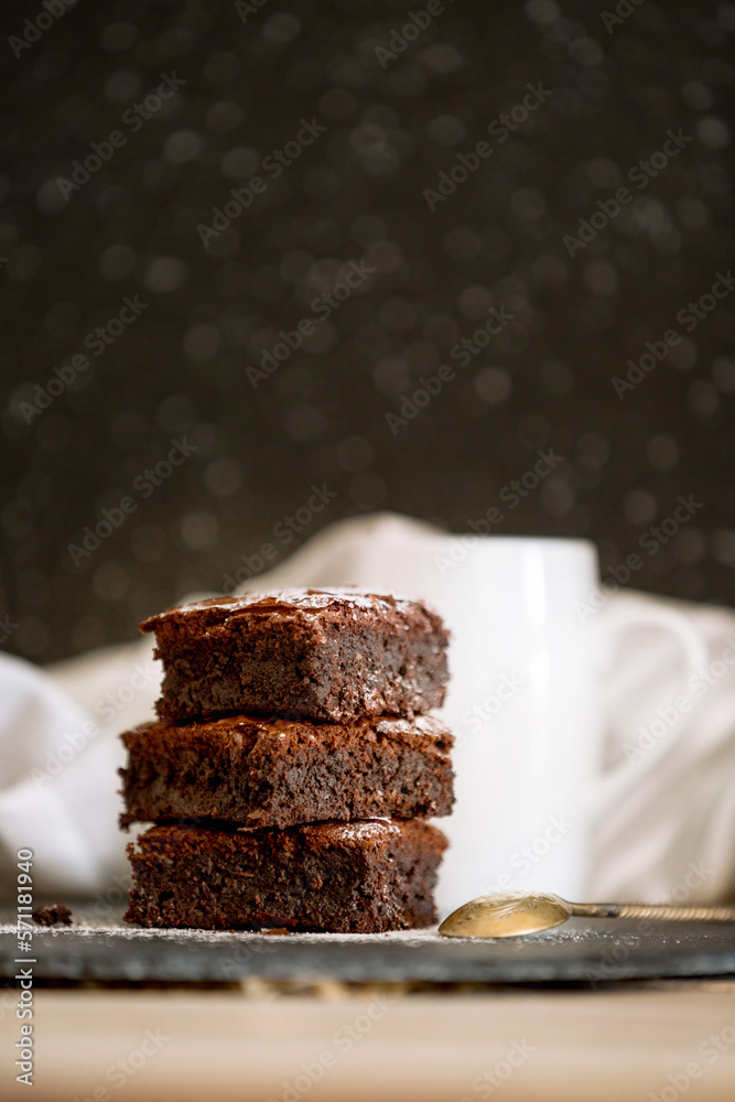 Dark chocolate brownies stack, copy space Dark chocolate brownies stack, copy space