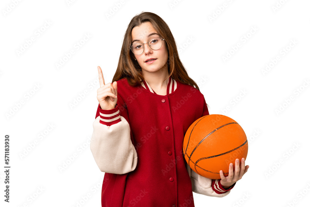 Teenager girl playing basketball over isolated chroma key background showing and lifting a finger in sign of the best Teenager girl playing basketball over isolated chroma key background showing and lifting a finger in sign of the best