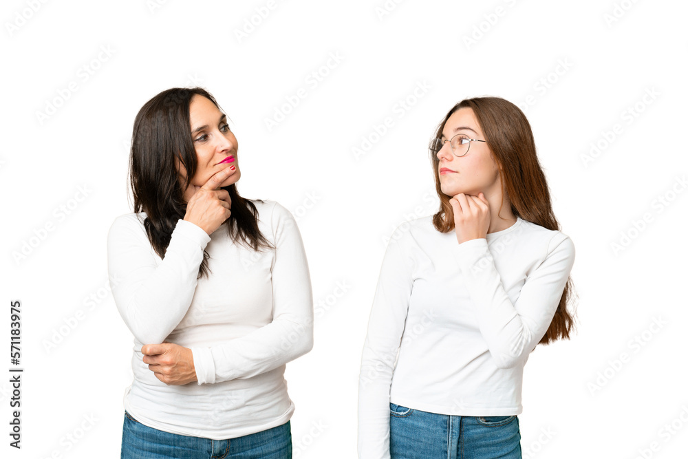 mother and daughter over isolated chroma key background standing and thinking an idea mother and daughter over isolated chroma key background standing and thinking an idea