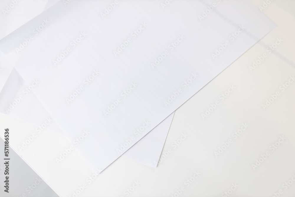 White paper on a white table. Administrative desk.