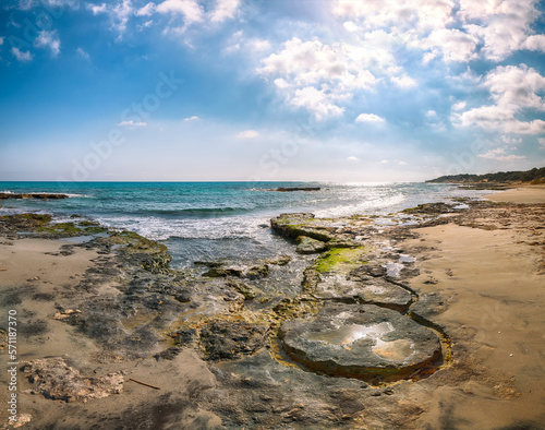 Fototapeta Naklejka Na Ścianę i Meble -  Fabulous seascape with rocky cliffs, sea bay, islets and faraglioni near by Frassanito Beach,